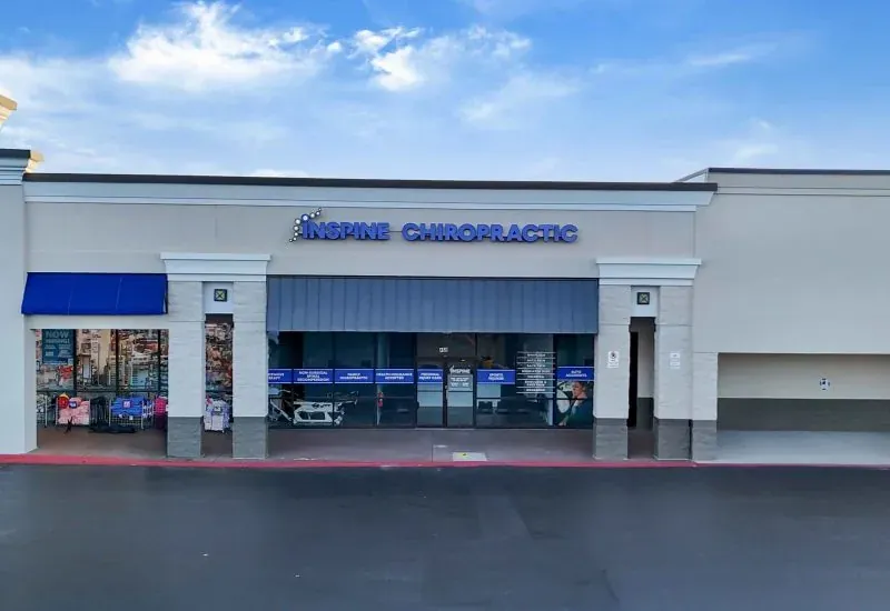 The Inspine Chiropractic storefront in a Calhoun retail center, with blue signage above the entrance.