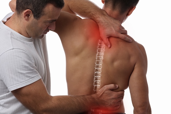 Man having chiropractic back adjustment.