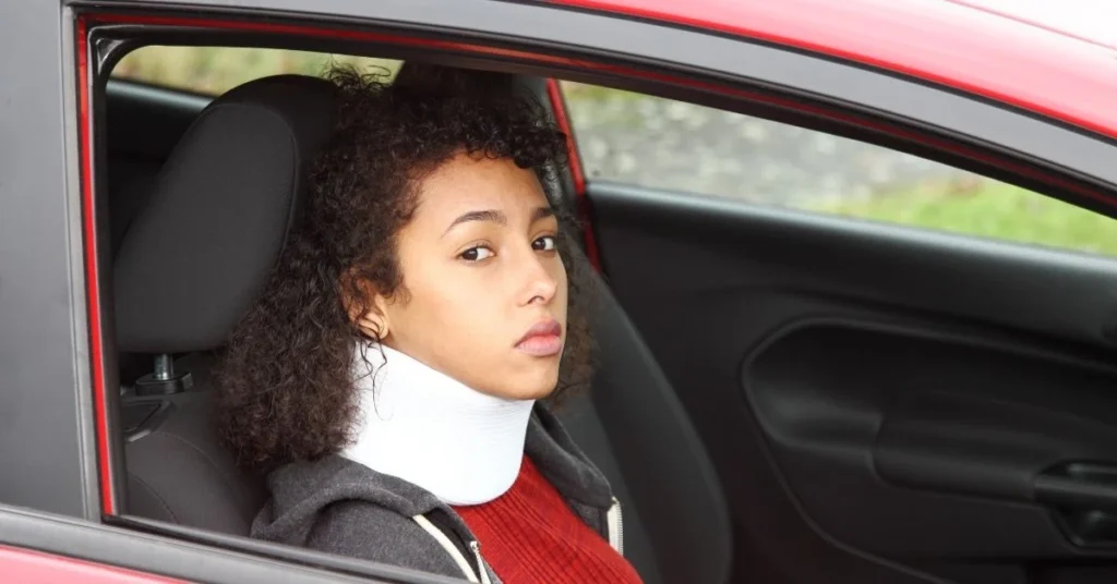 patient-sitting-in-a-car-after whiplash injury