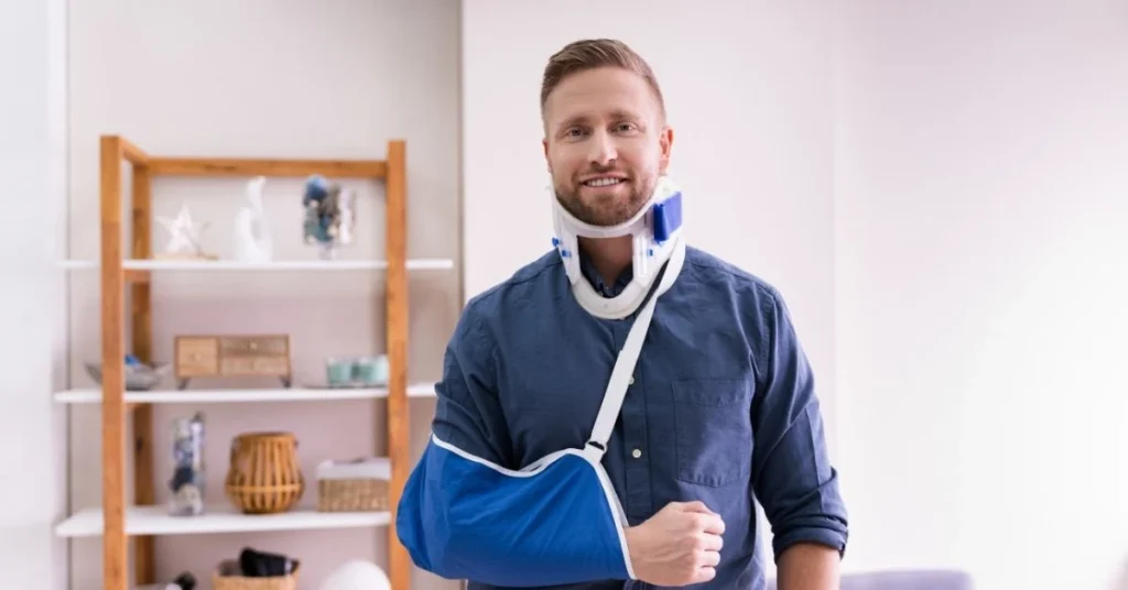 man-wearing-neck-brace-and-arm-sling-recovering-from-whiplash-injury