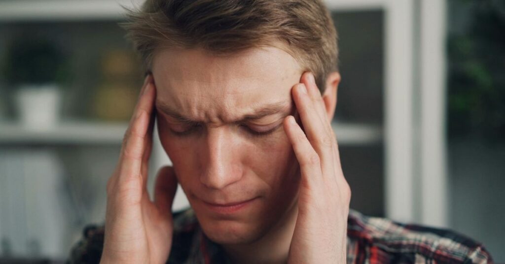 man-is-having-headache-need-chiropractic-care