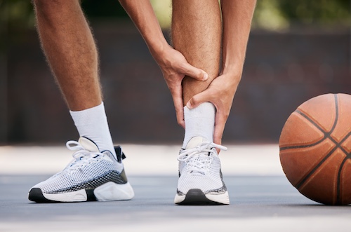 Man Playing Basketball With Injury