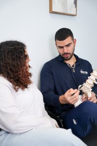 lower back pain relief Chattanooga TN chiropractor evaluating a new patient