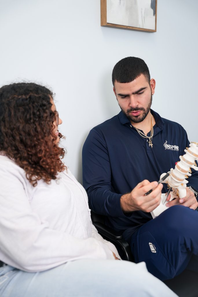 lower back pain relief Chattanooga TN chiropractor evaluating a new patient