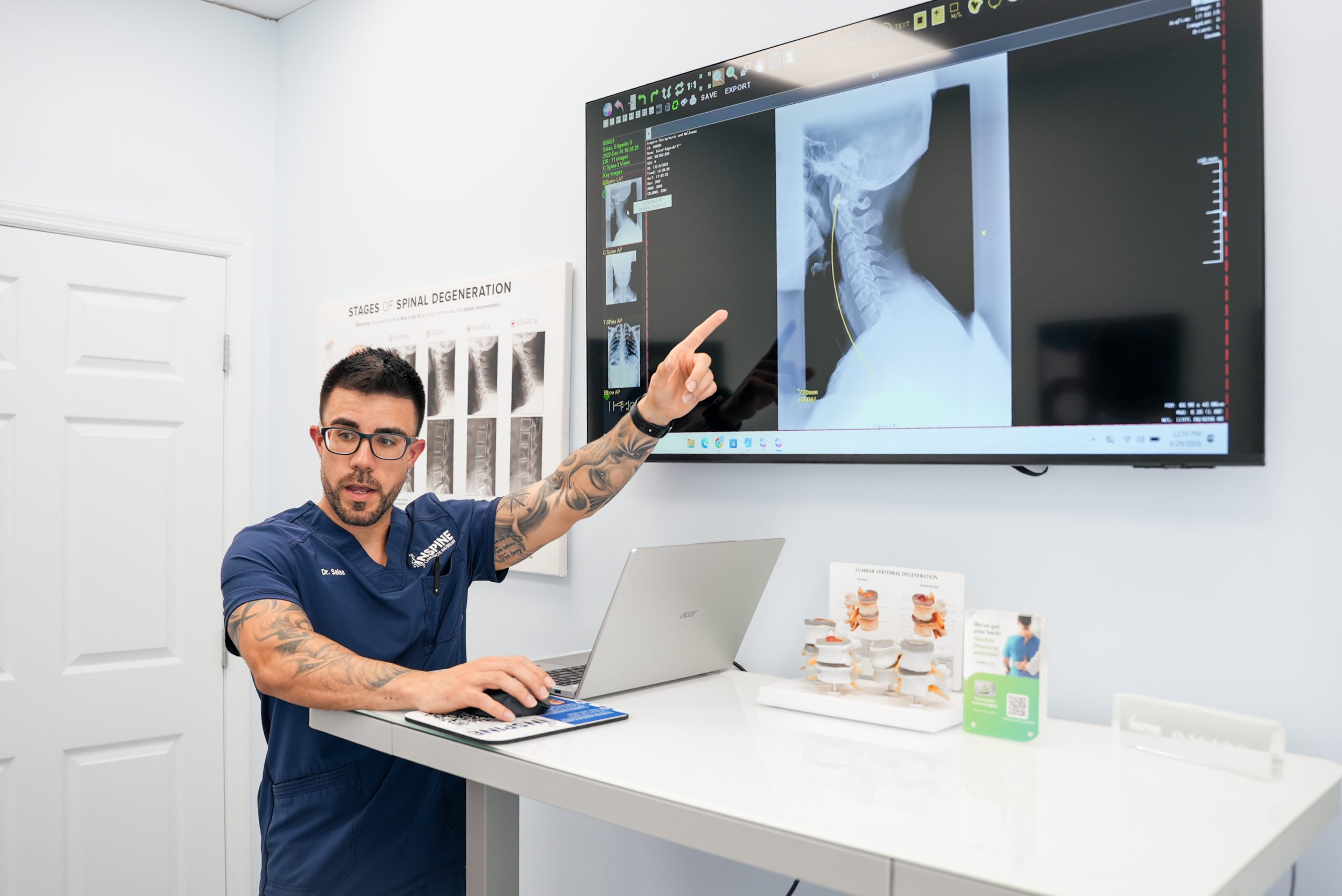 chiropractor reviewing a neck X-ray during a Calhoun evaluation