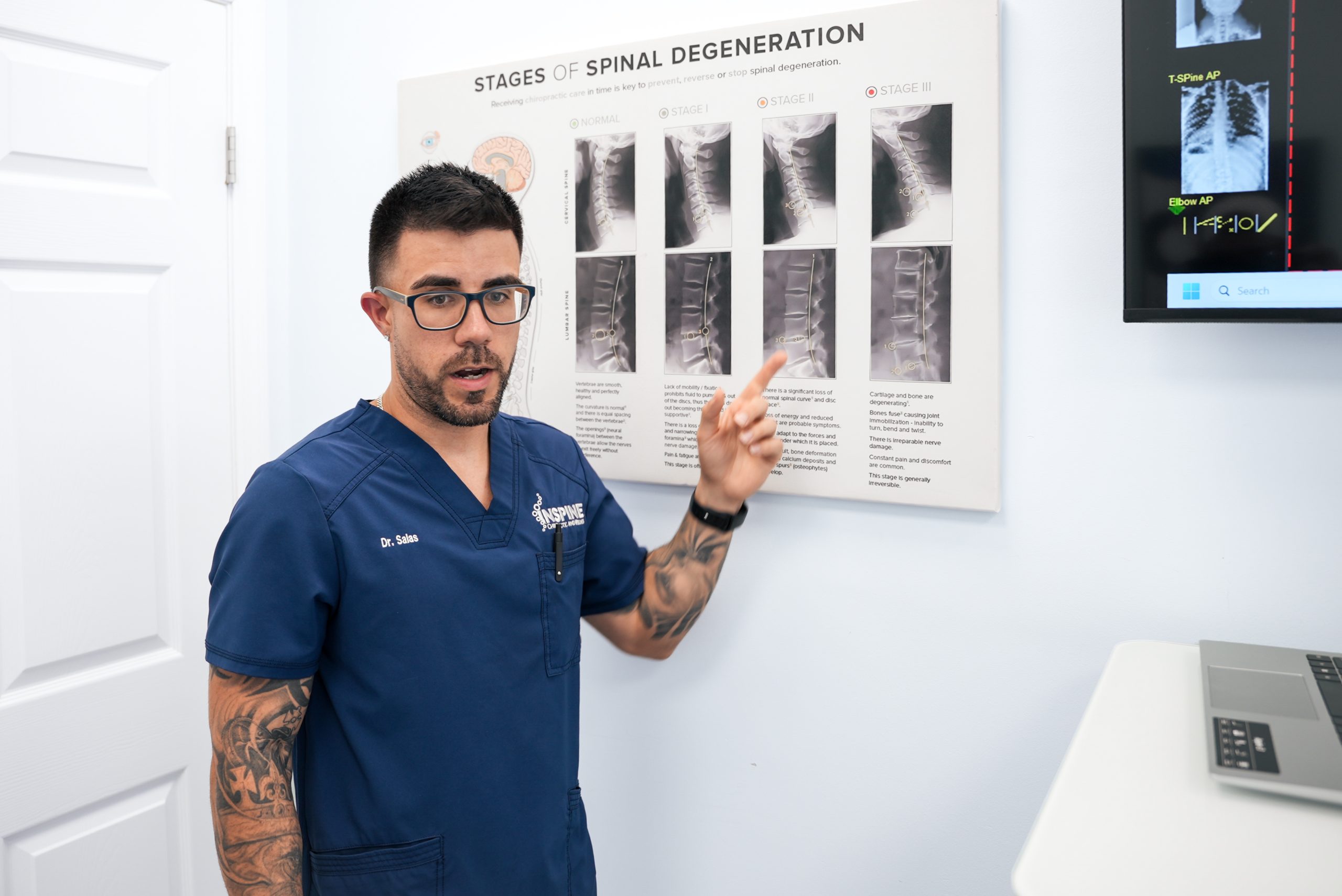 chiropractor explaining spinal health during a lower back pain evaluation in Calhoun